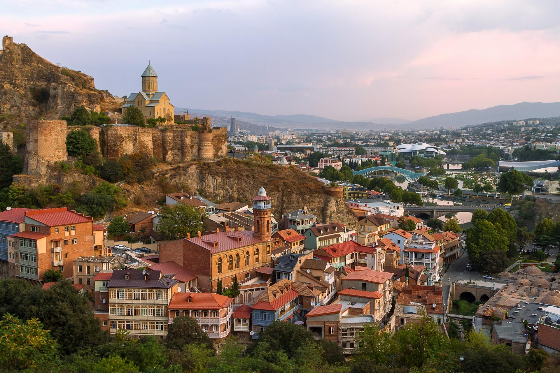 Aerial view of architecture in Tbilisi with cloudy sky