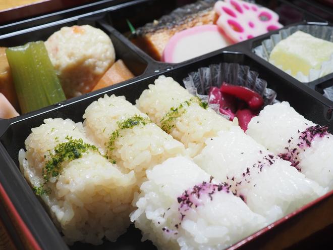 Japanese bentō box –⁠  few pieces of sushi packed to take away.