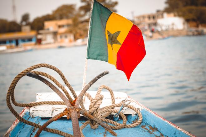 A boat with the flag of Senegal.