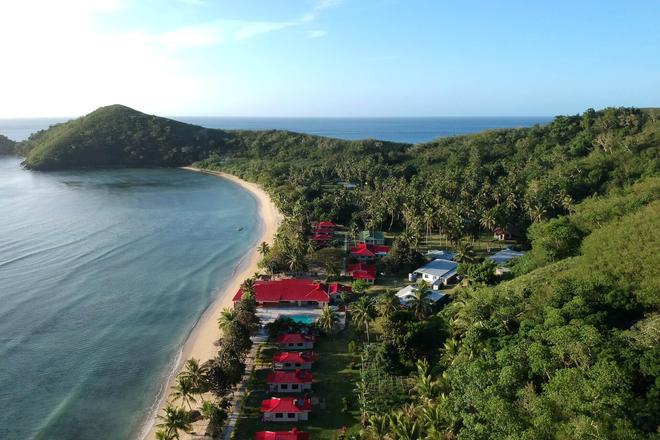 An aerial view of one of Fiji's islands, sea and a resort