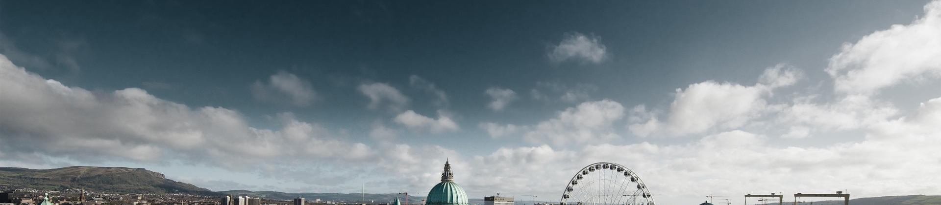 Aerial view of architecture in Belfast in sunny weather with few clouds