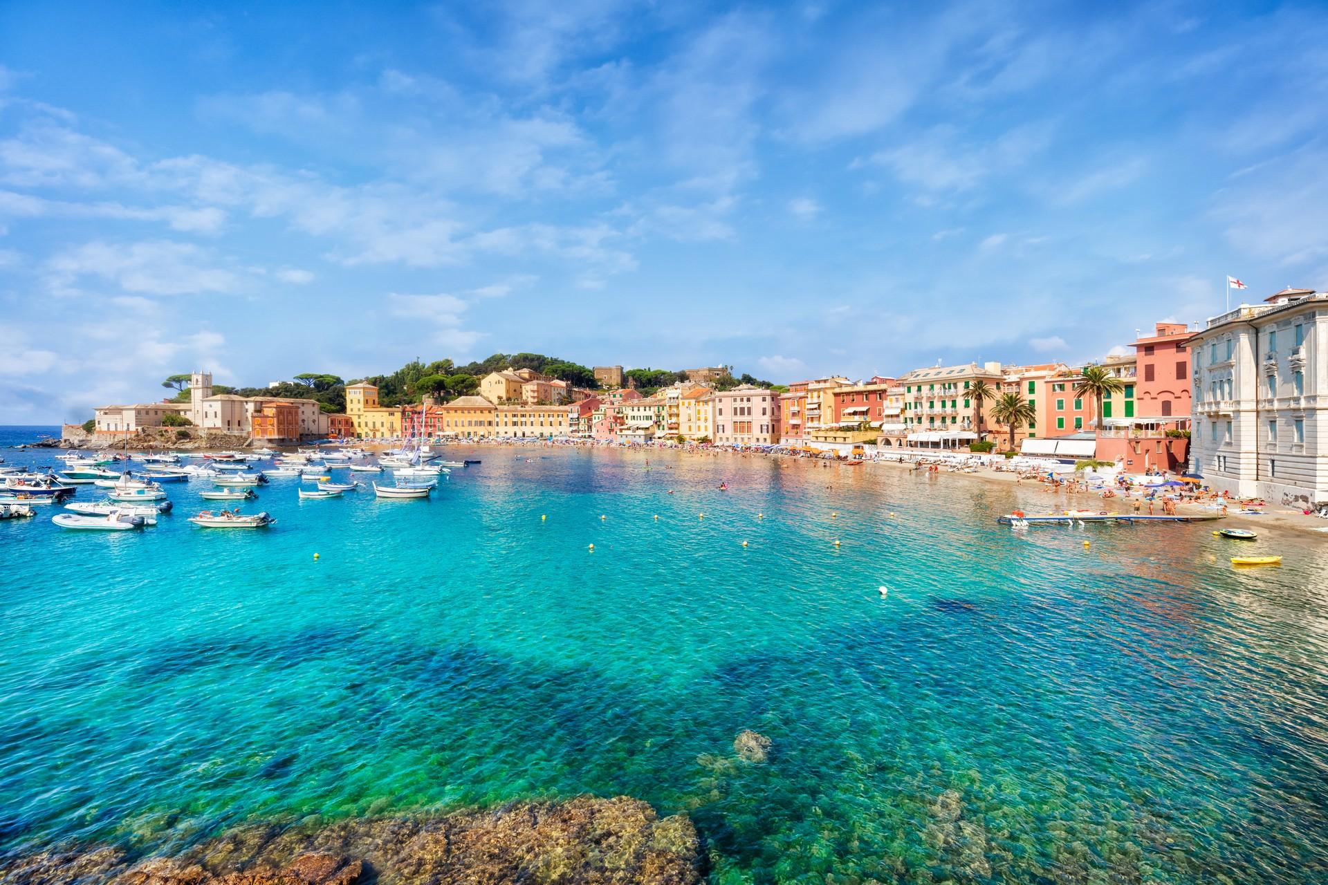 Aerial view of boat in Sestri Levante on a sunny day with some clouds