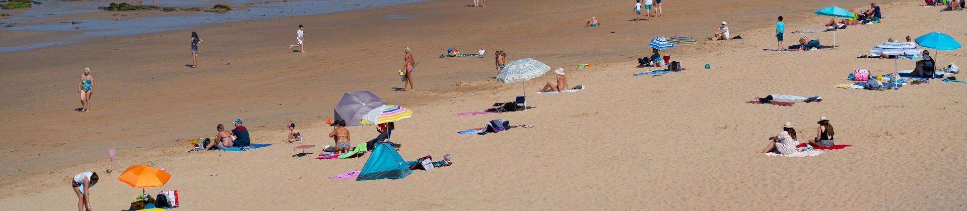 Aerial view of beach with a lot of people in Les Sables-d'Olonne with nice weather and blue sky