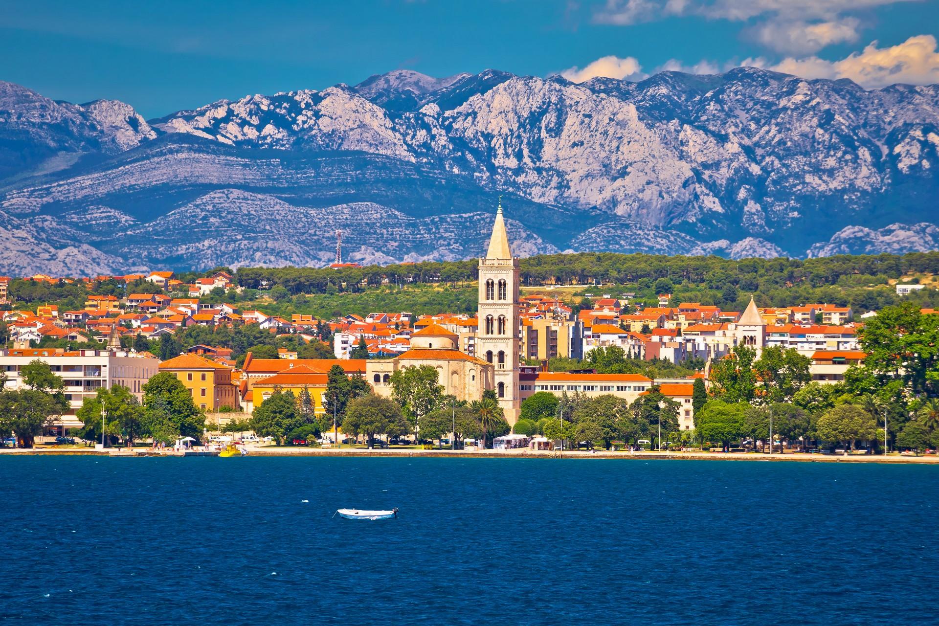 Aerial view of mountain range in Zadar in sunny weather with few clouds