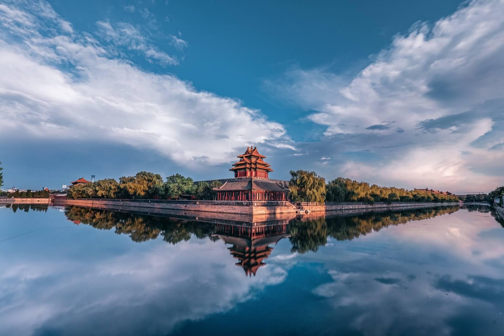 View of a chinese temple surrounded by trees and water