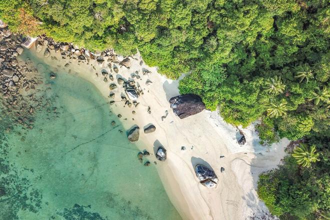 View of a sandy beach, rocks and forests of Koh Lipe