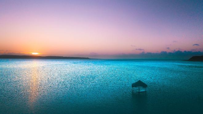 Colourful sunset over the azure blue sea in Mozambique.