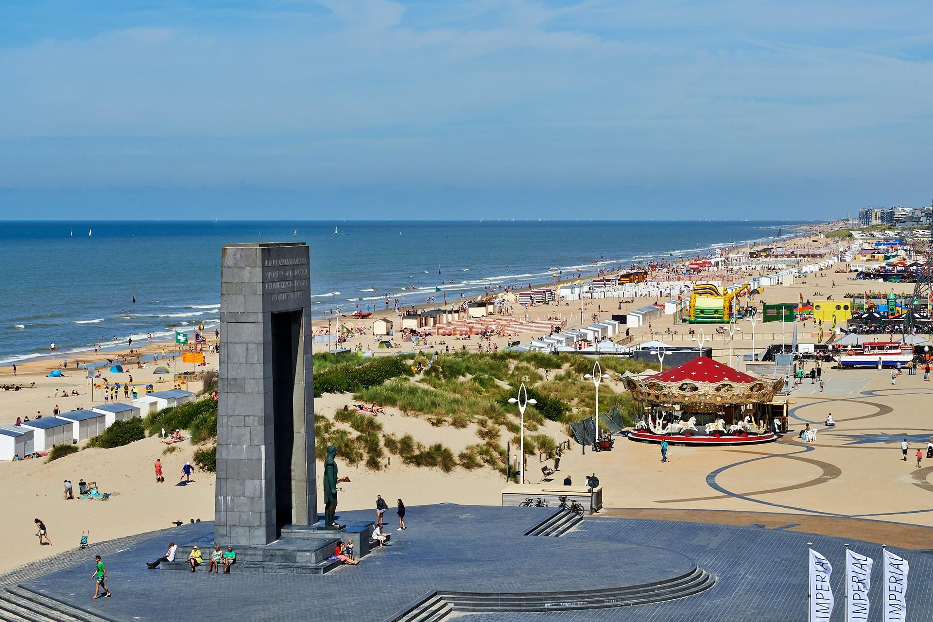 Aerial view of beach with a lot of people in De Panne with cloudy sky