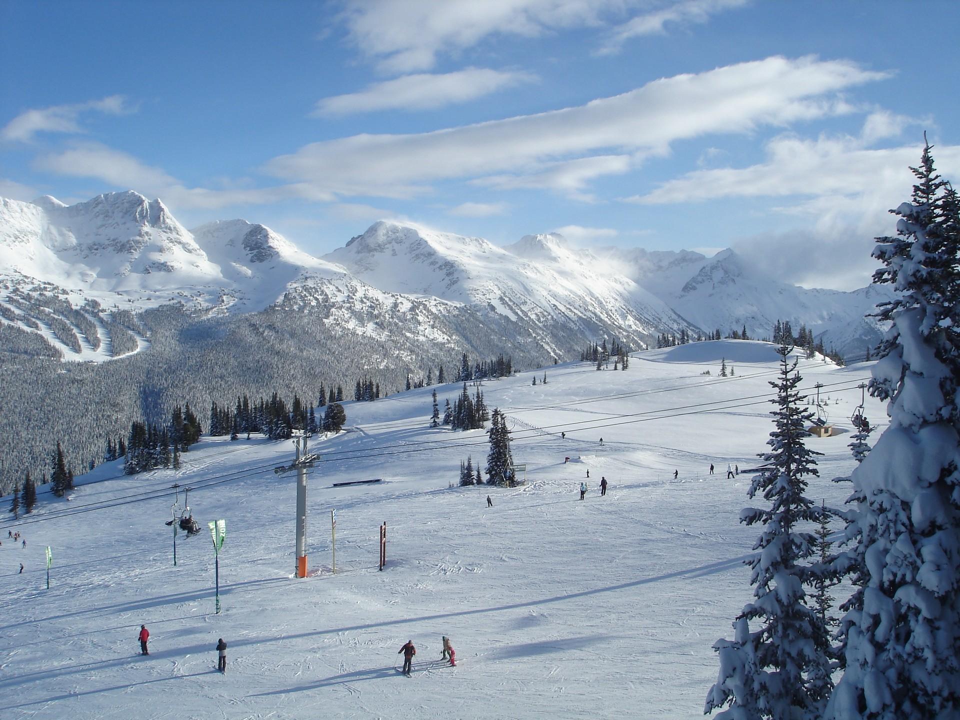 Mountain range in Whistler on a sunny day with some clouds