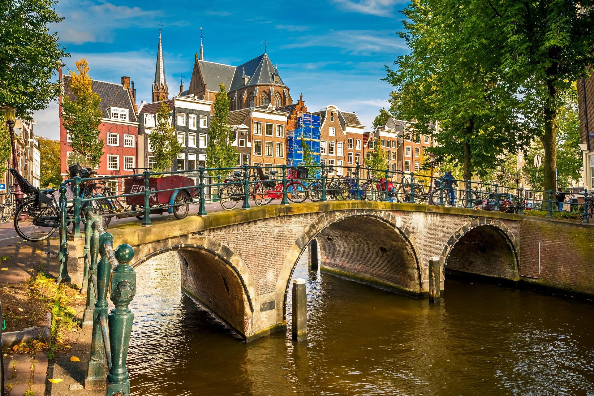 Bridge in Amsterdam in sunny weather with few clouds