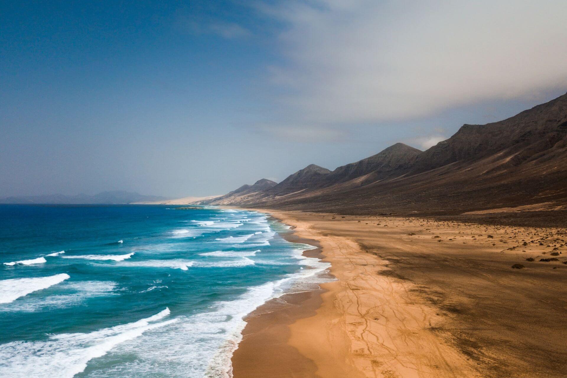 View of dunes, beach, mountains and sea, Fuerteventura