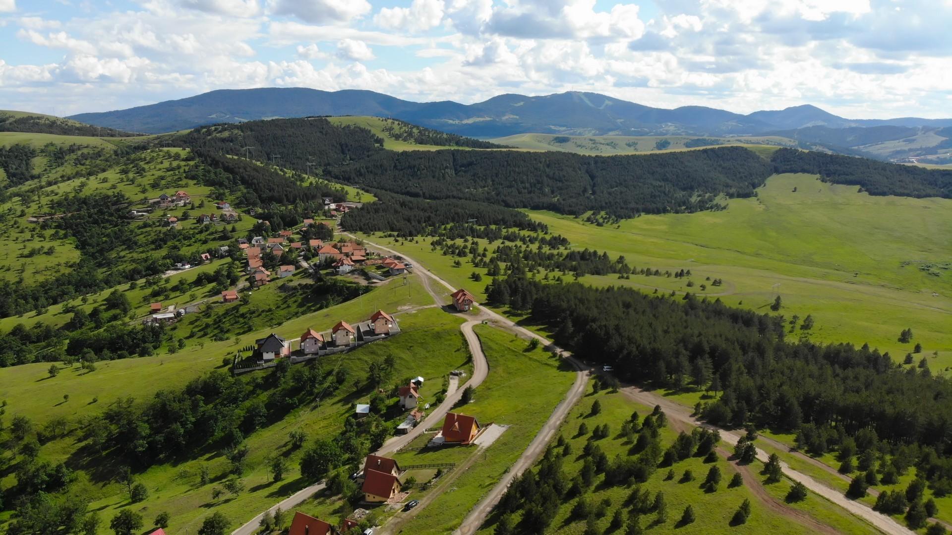 Aerial view of countryside near Zlatibor on a day with cloudy weather