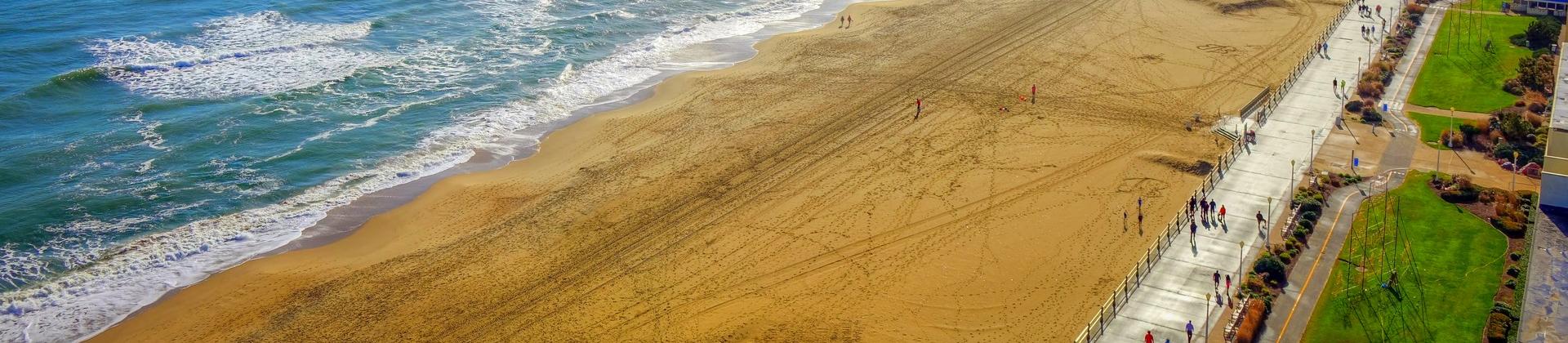 Aerial view of amazing beach in Virginia Beach on a sunny day with some clouds