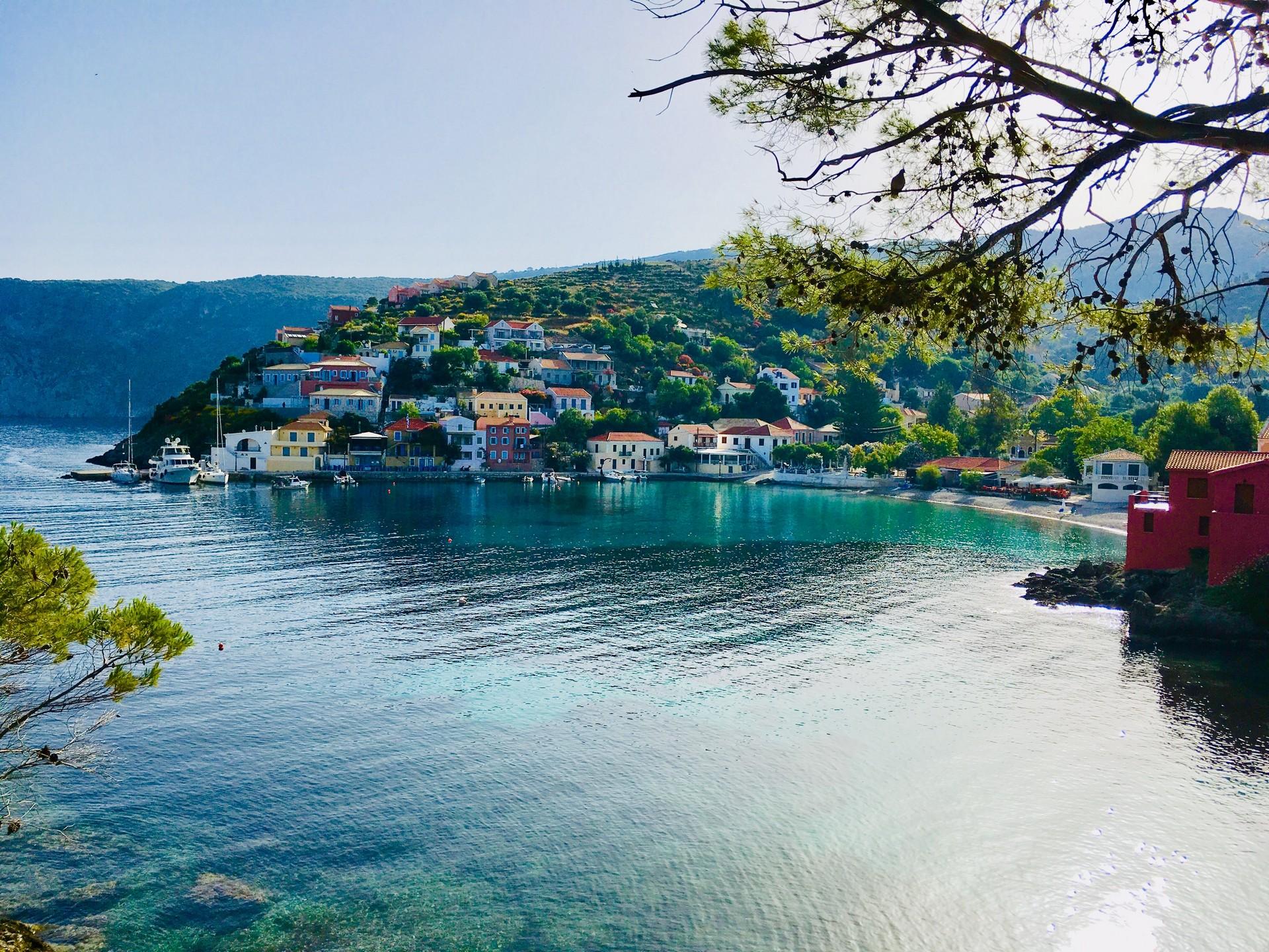 Picturesque village at the foot of the hill by the sea on Greece West Coast.