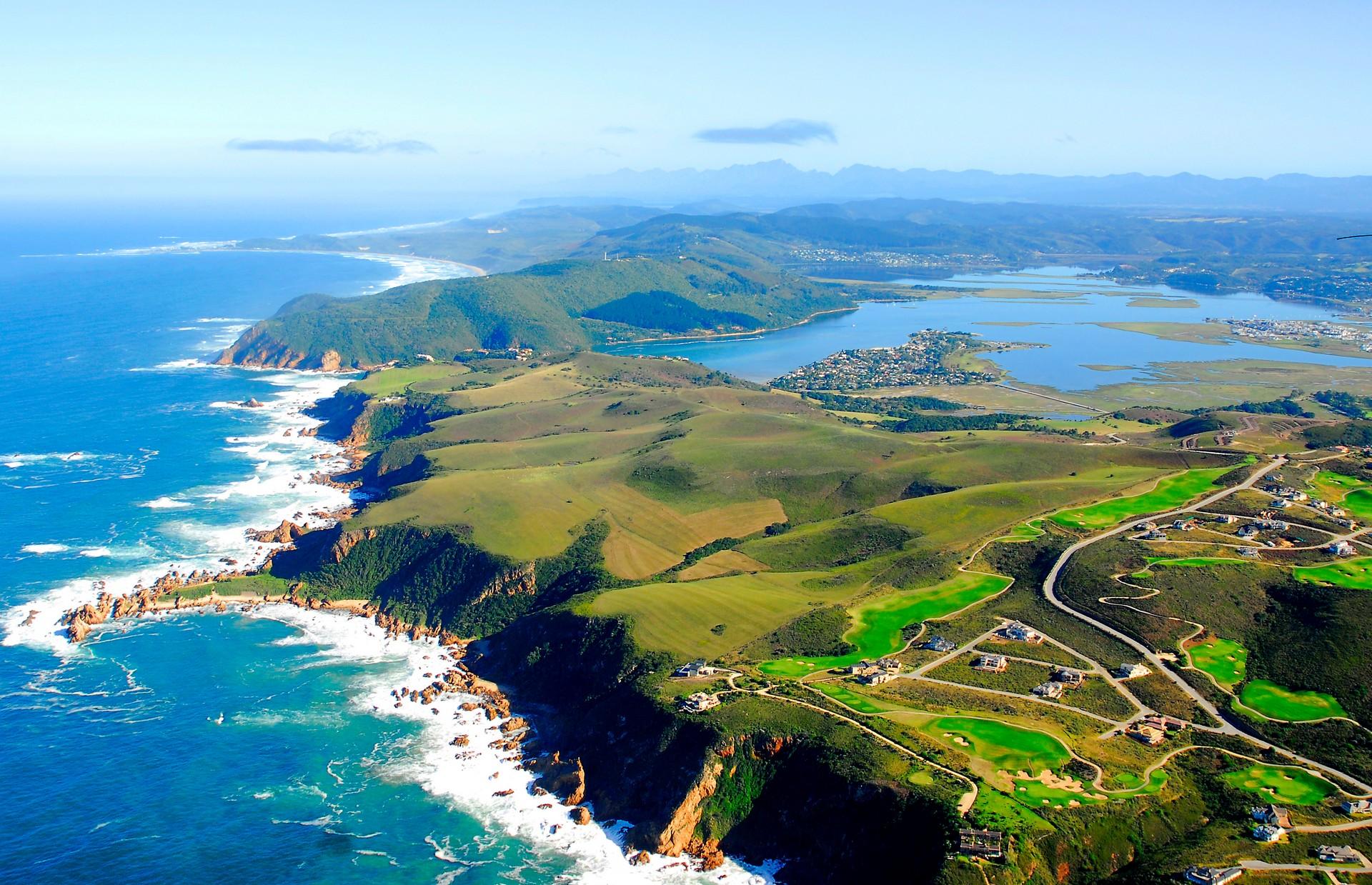 Aerial view of countryside in Knysna on a sunny day with some clouds