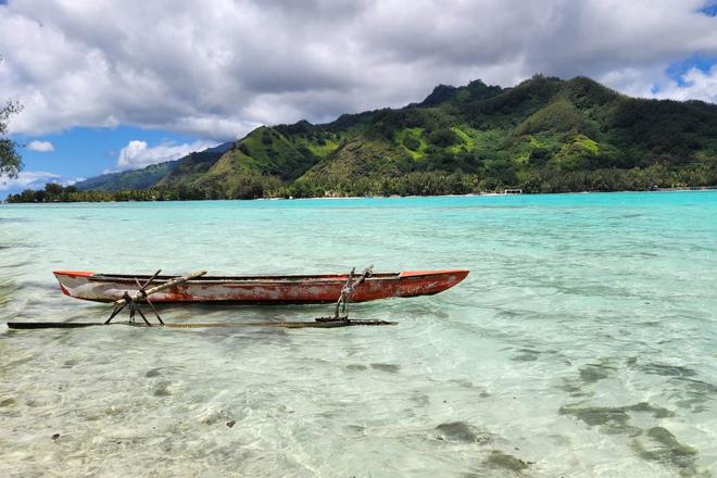 A boat on the sea and an island in the background