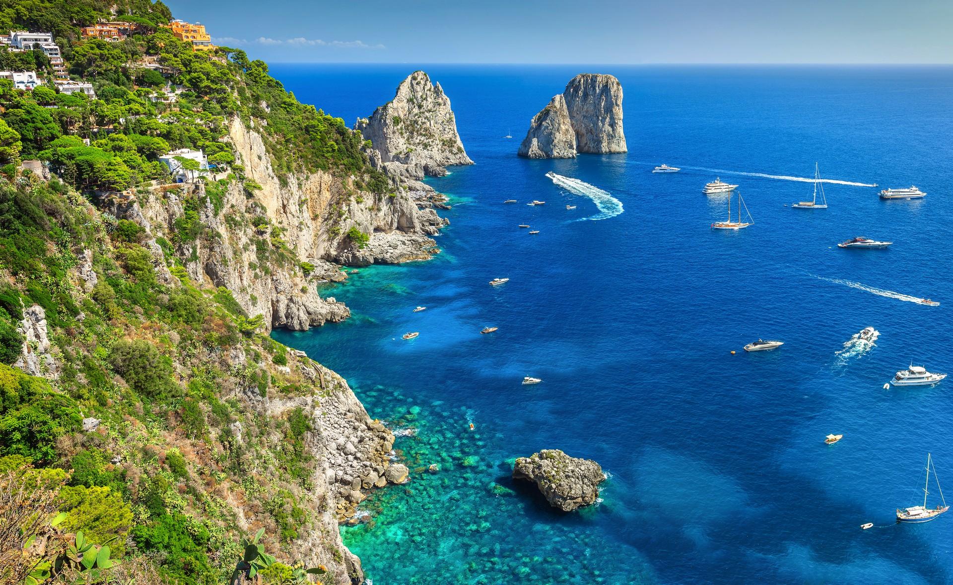 Aerial view of beach in Capri on a sunny day with some clouds