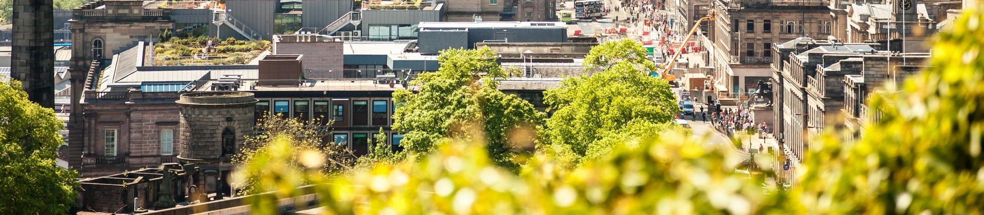 Aerial view of architecture in Edinburgh in sunny weather with few clouds