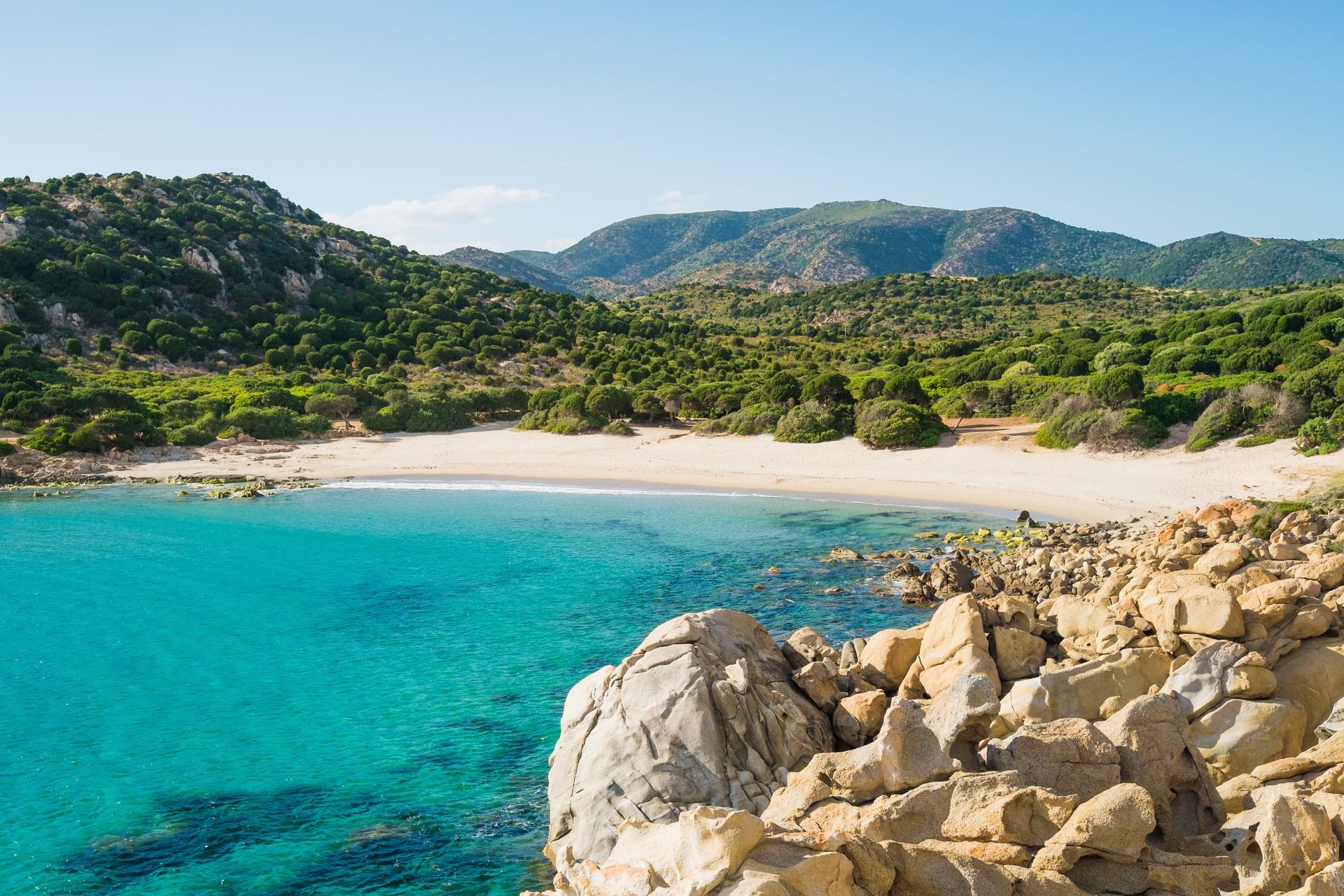 Amazing beach with turquise water near Chia in partly cloudy weather