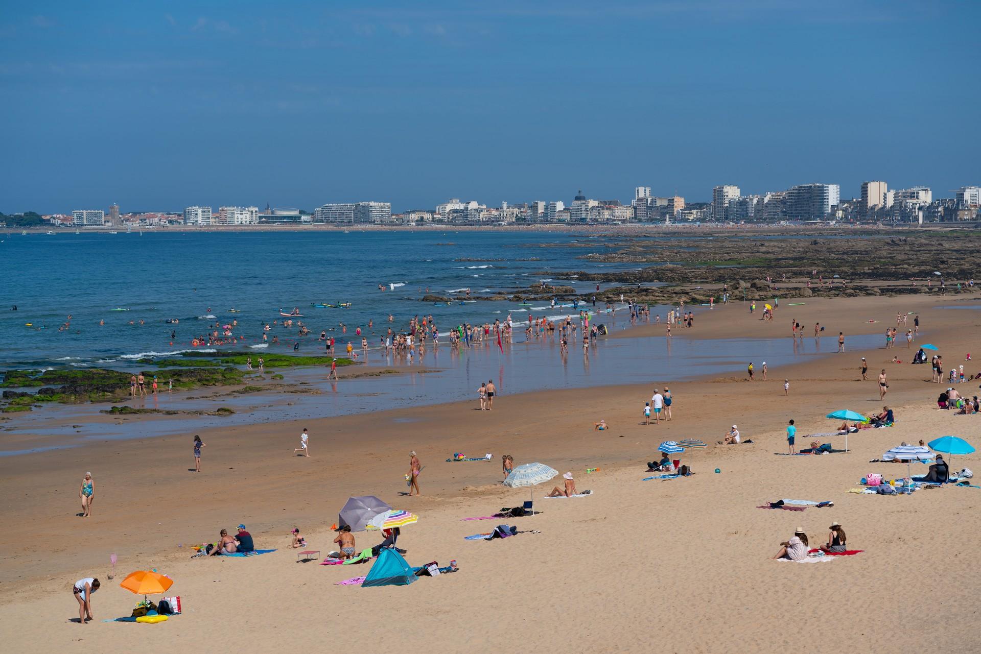 Aerial view of beach with a lot of people in Les Sables-d'Olonne with nice weather and blue sky