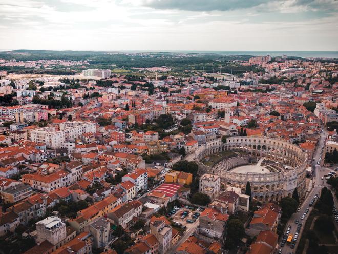 View of the city of Pula with the Roman amphitheater from above.