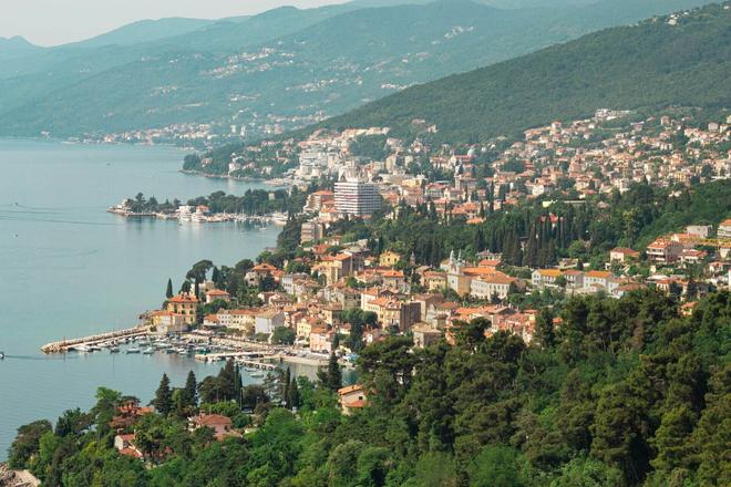 View of the beautiful city of Opatija surrounded by hills and forest in Istria