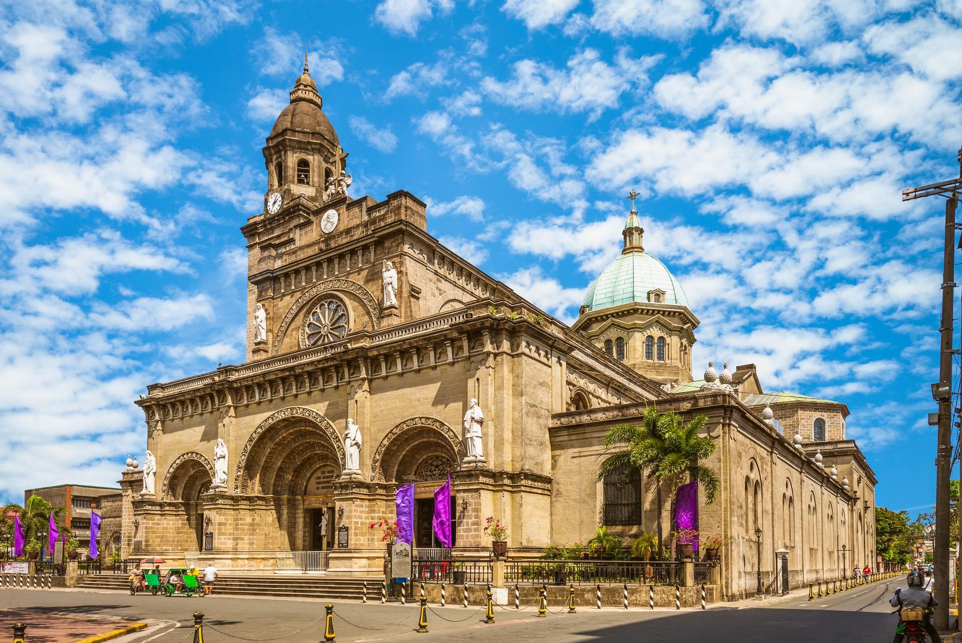 Architecture in Manila in sunny weather with few clouds