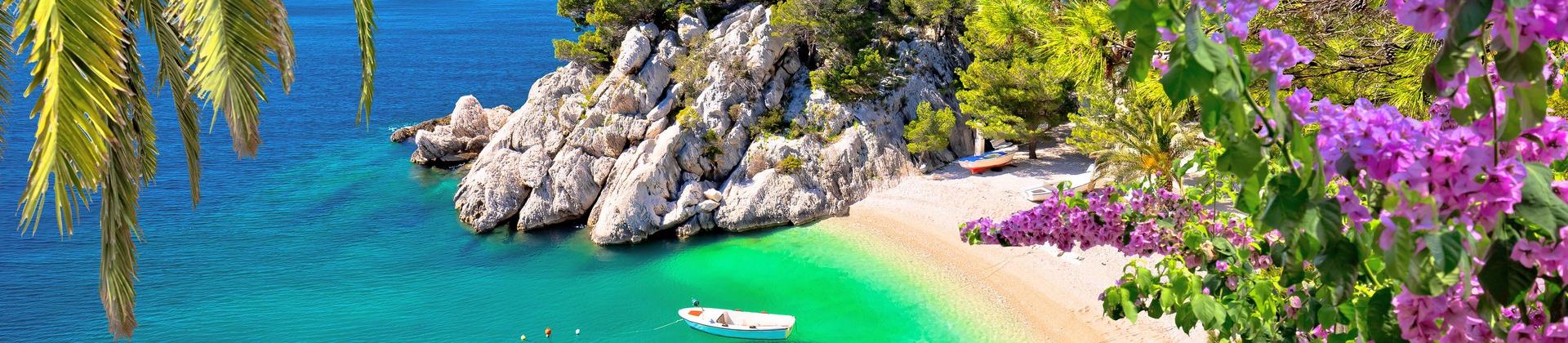 Enjoyable beach with turquise water near Omiš on a sunny day with some clouds