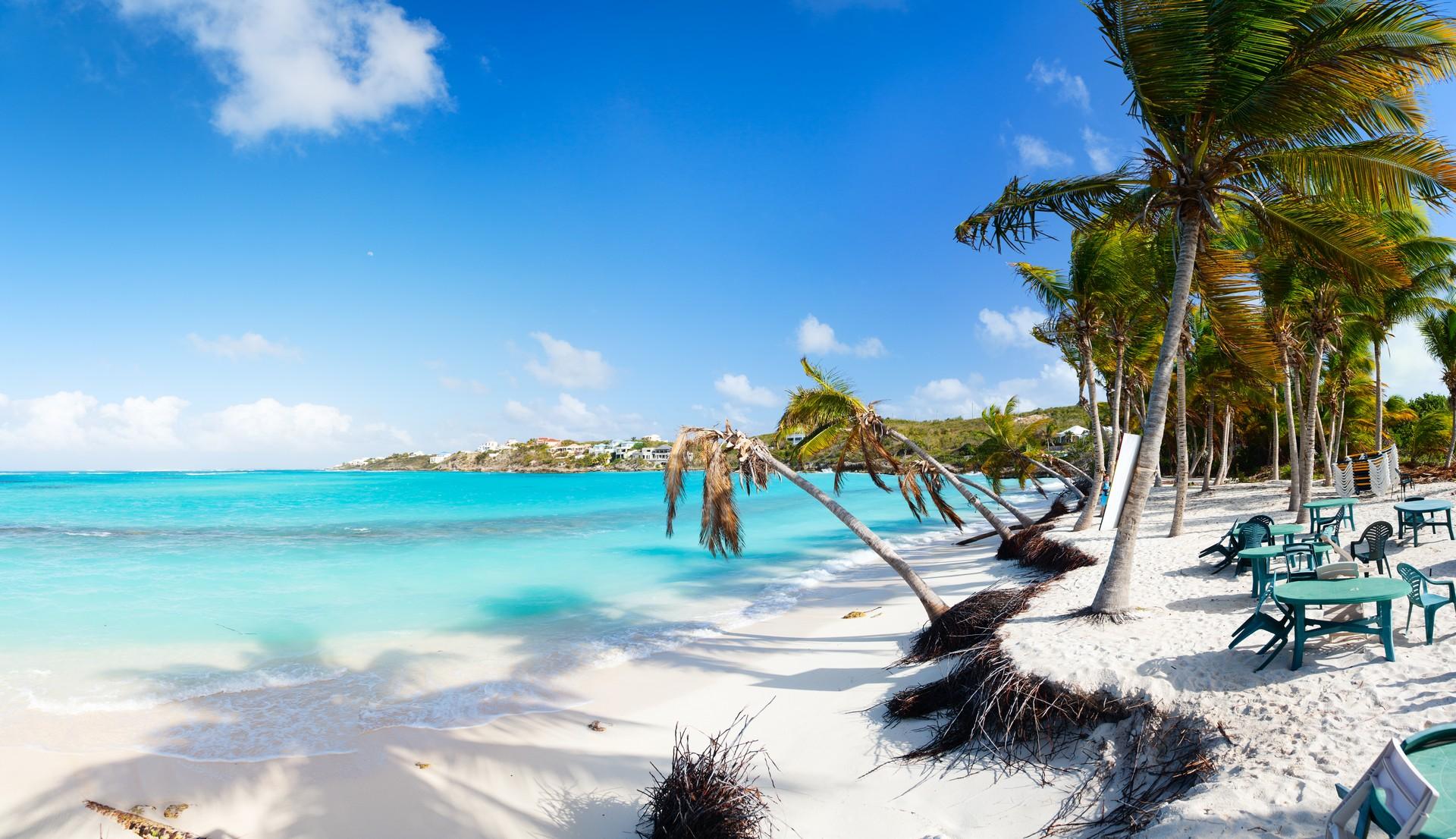 Enjoyable beach with turquise water in Anguilla on a sunny day with some clouds