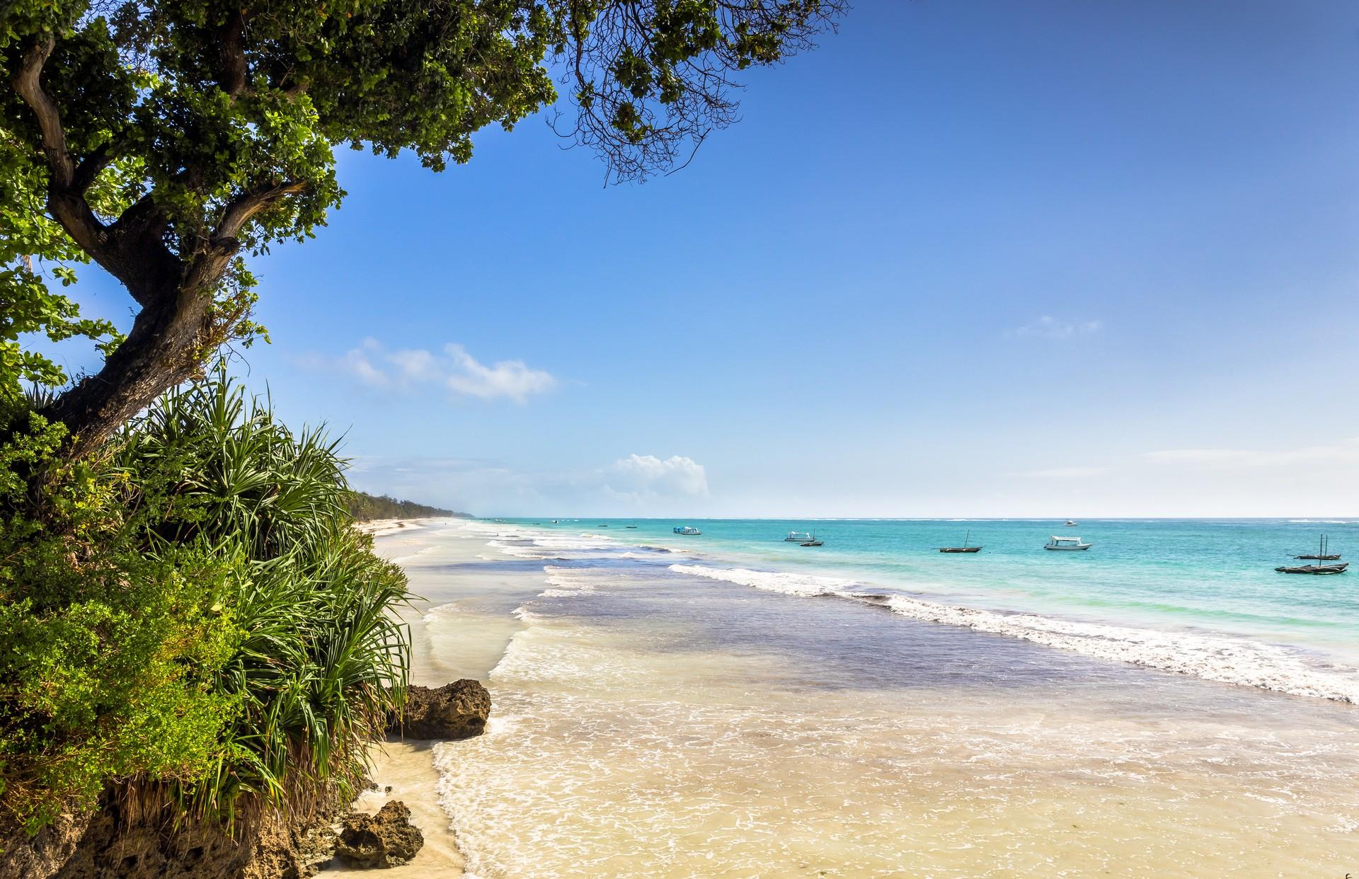 Amazing beach with turquise water in Diani Beach in partly cloudy weather