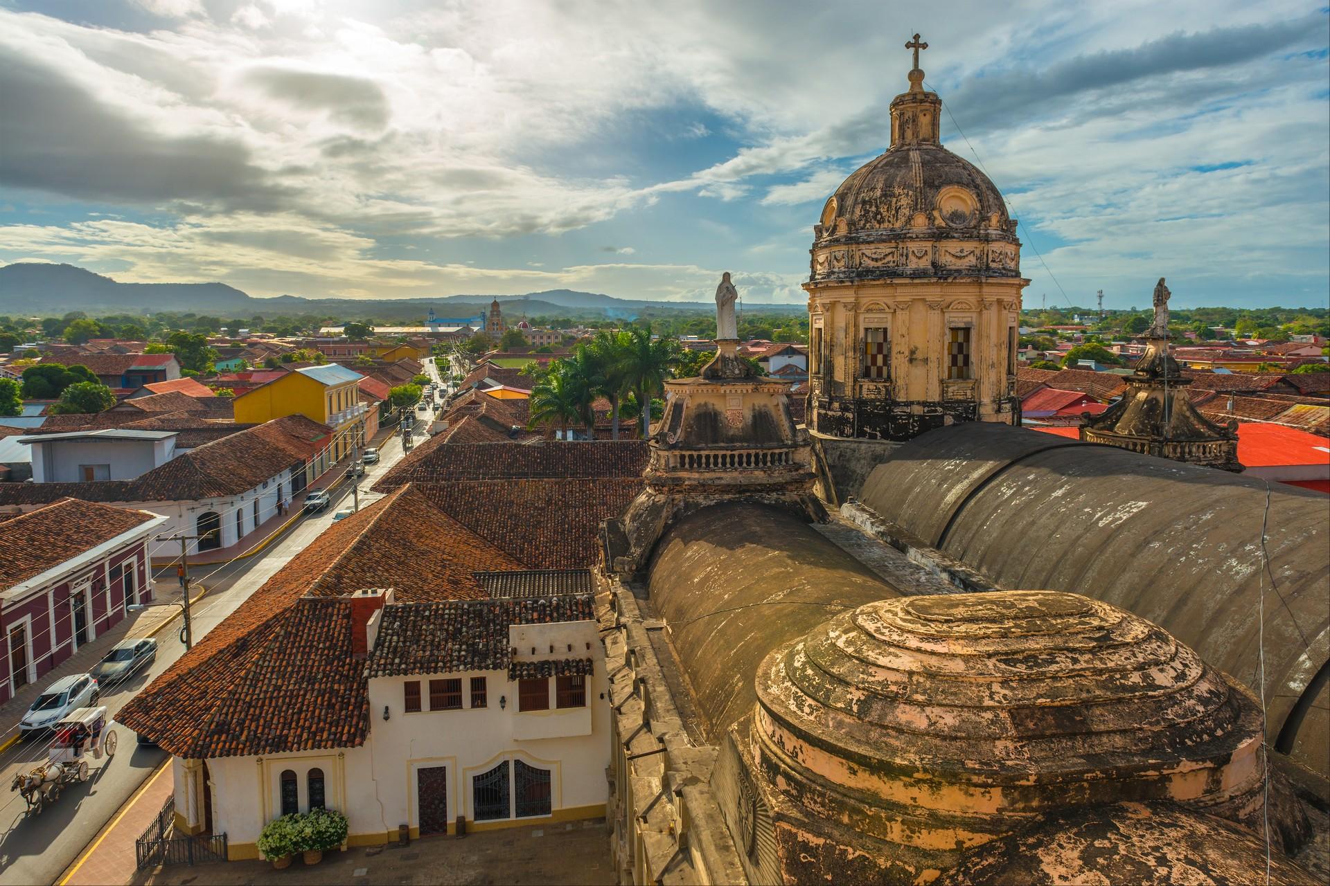 Nicaragua, Granada: rooftop view of the church and the adjacent street.