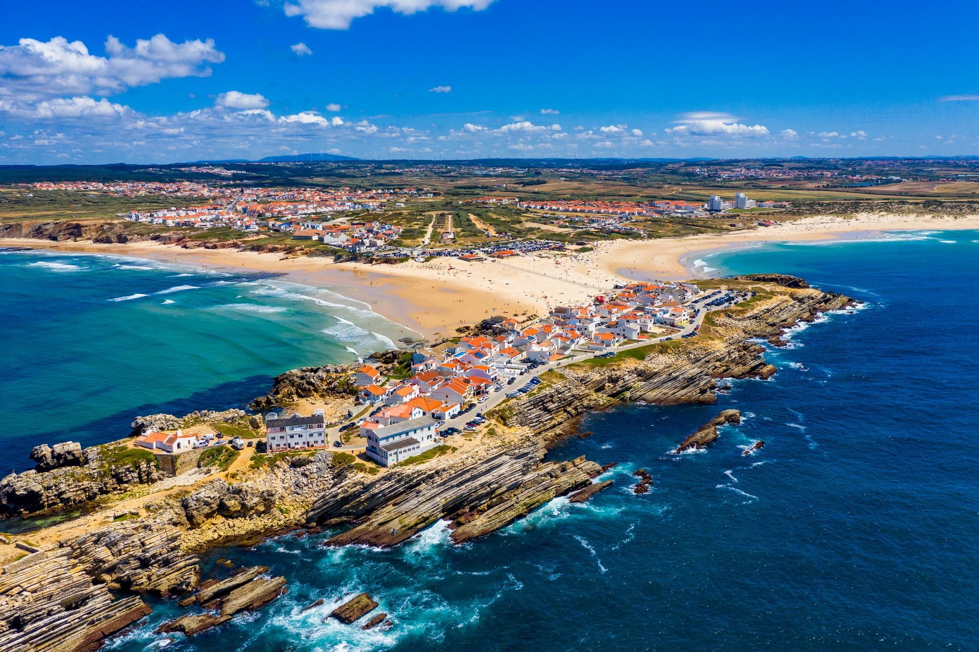 Aerial view of beach in Peniche in partly cloudy weather