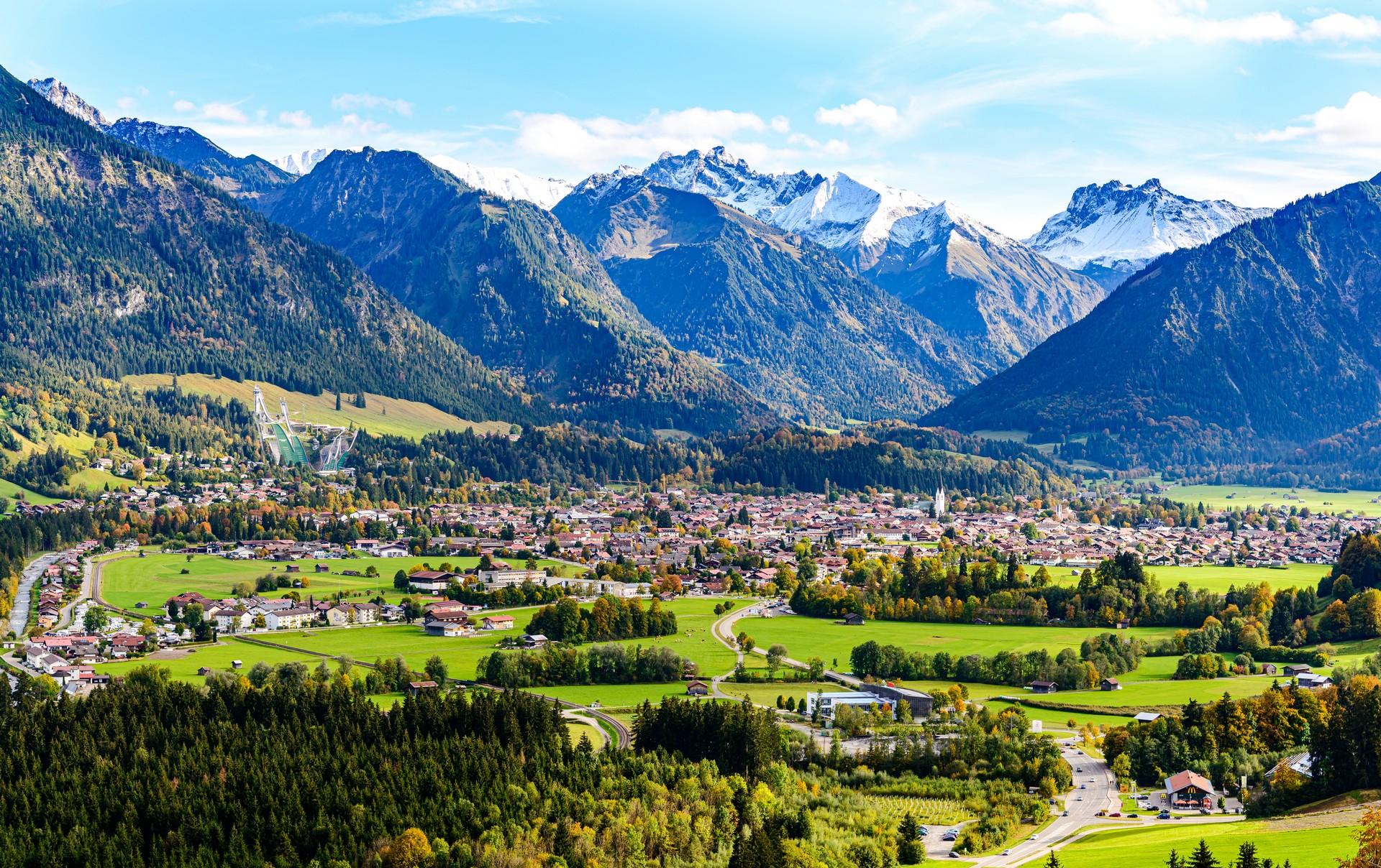Aerial view of mountain range in Oberstdorf in partly cloudy weather