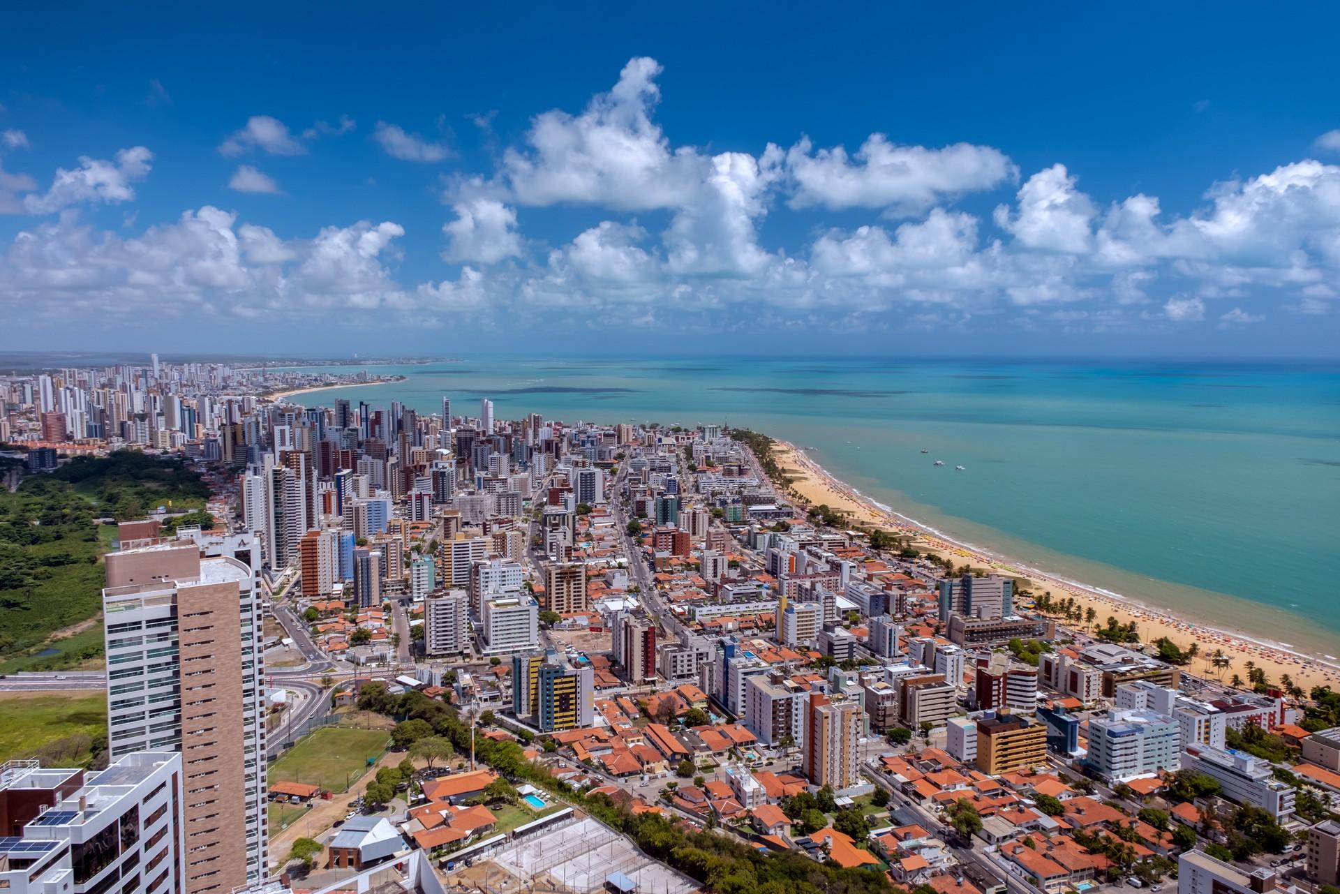 Aerial view of beach in Joao Pessoa on a sunny day with some clouds