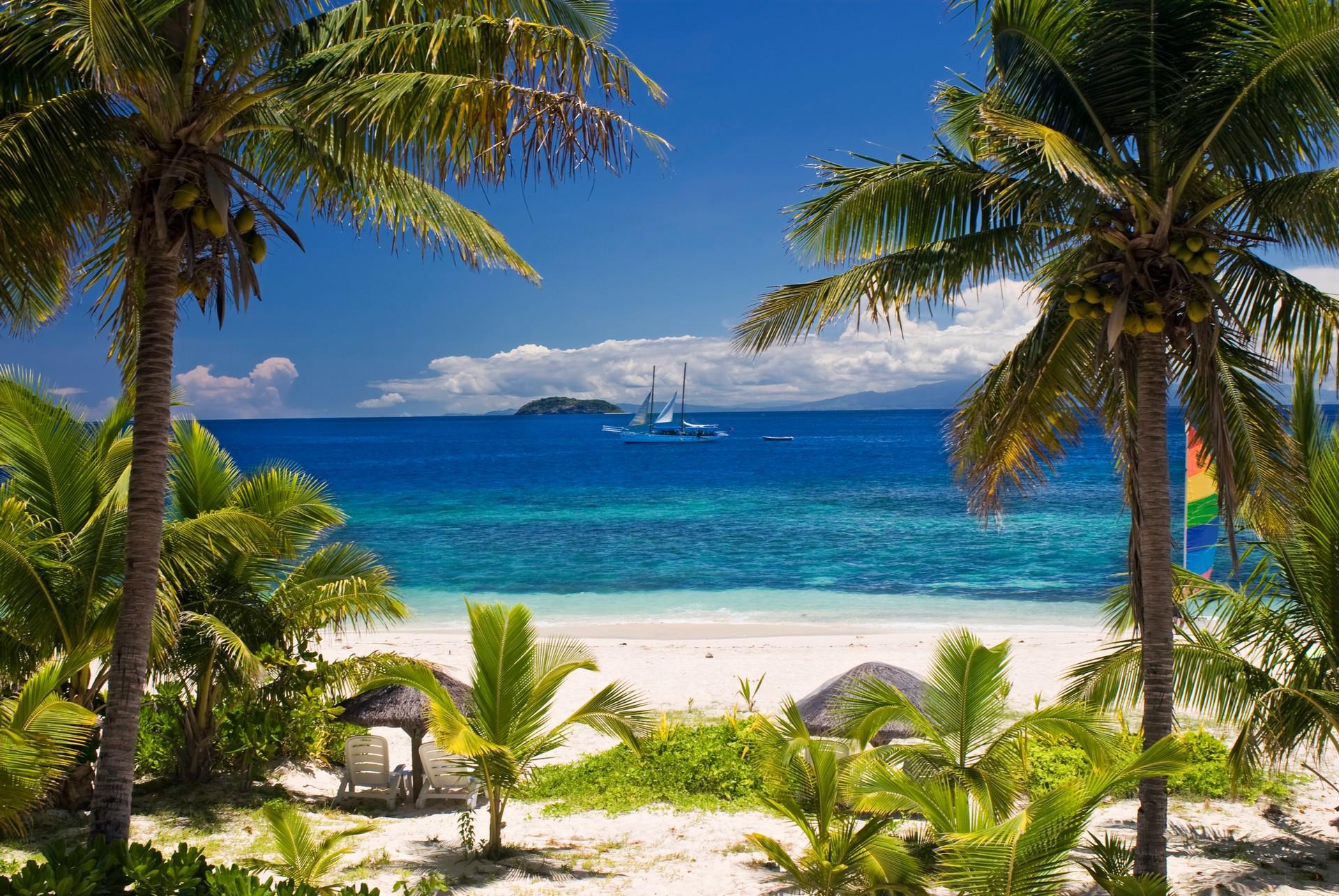 Boat in Fiji on a sunny day with some clouds