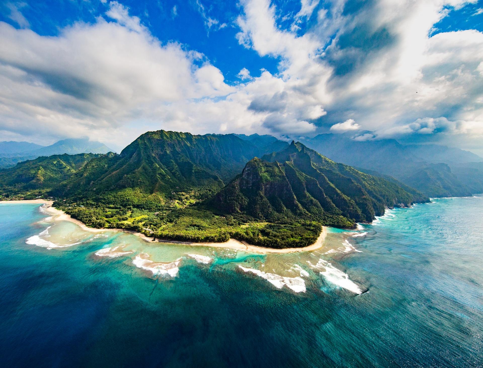Aerial view of beach in Kauai in partly cloudy weather