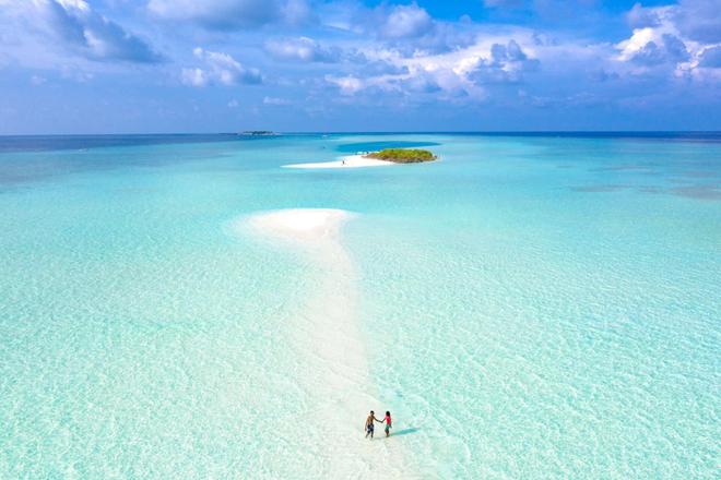 A view of a sandbank in the middle of the sea in the Maldives