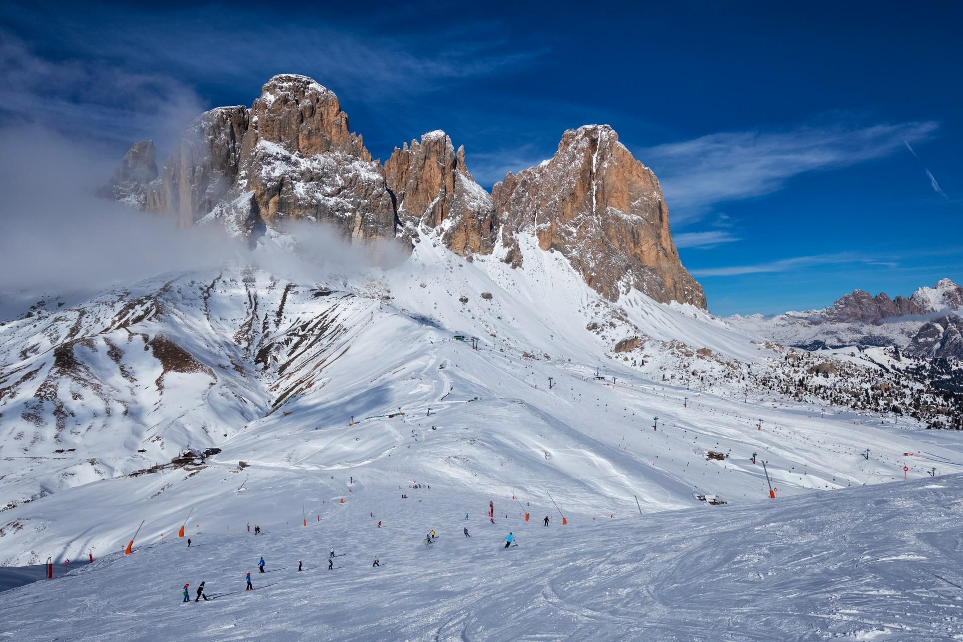 Mountain range in Val Gardena on a sunny day with some clouds
