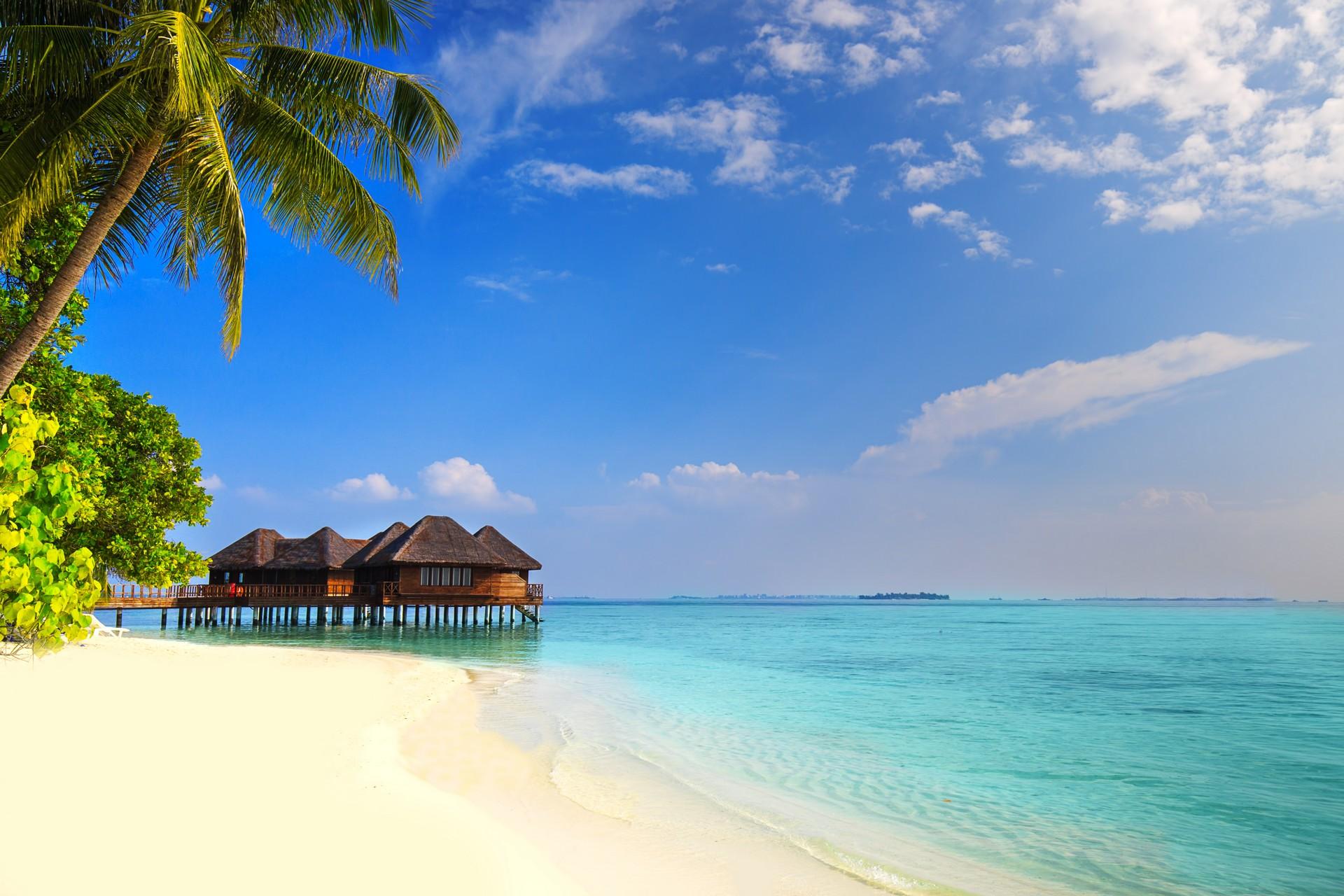 Amazing beach with turquise water in Tahiti in partly cloudy weather