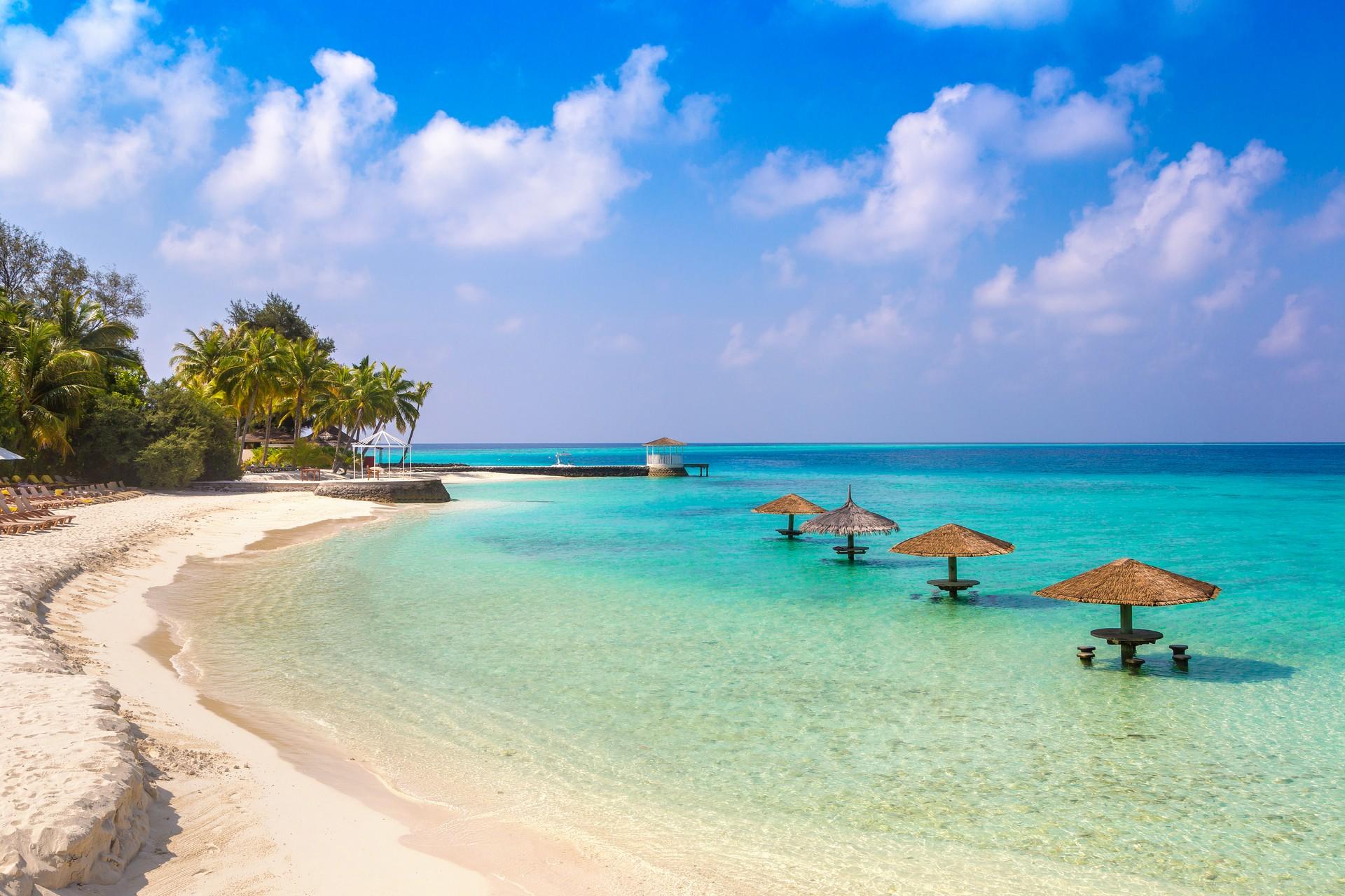 Nice beach and port in Aitutaki in partly cloudy weather