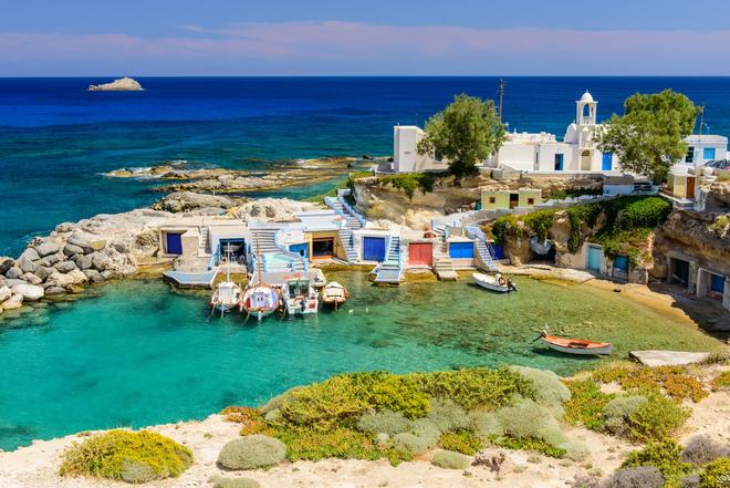 Small harbour with boats in the bay of the island of Mílos.