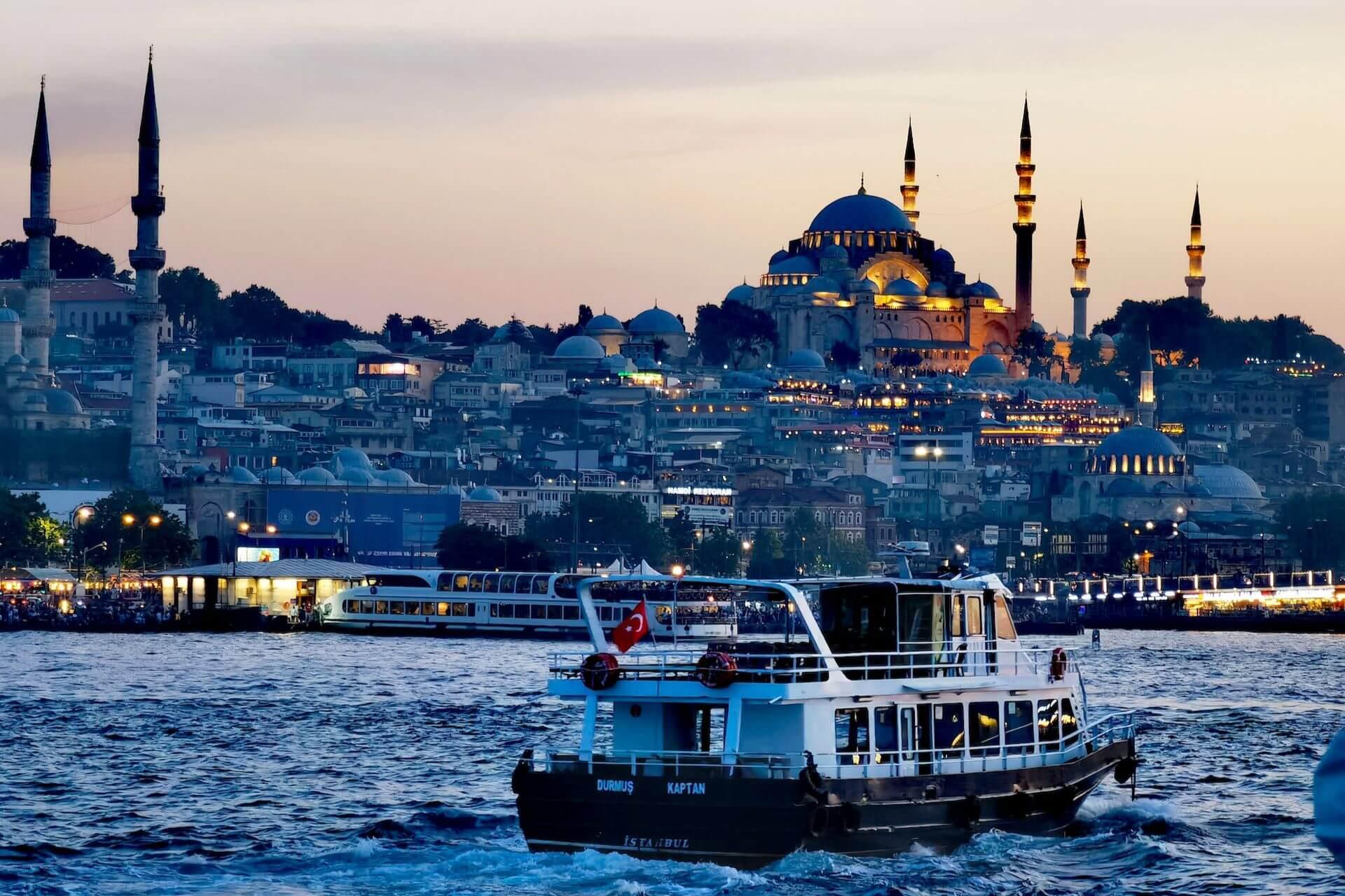 A view of boat on the sea and the Istanbul city at sunset