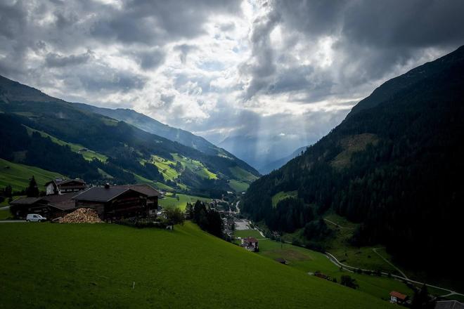 View of green mountains, trails and cottages