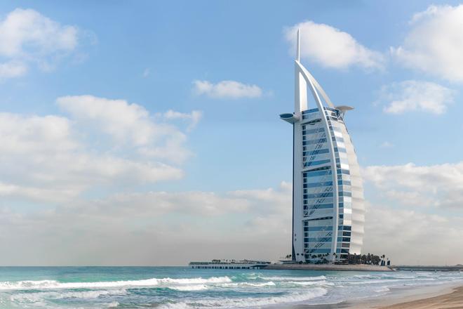 The Burj Al Arab skyscraper in Dubai surrounded by the sea