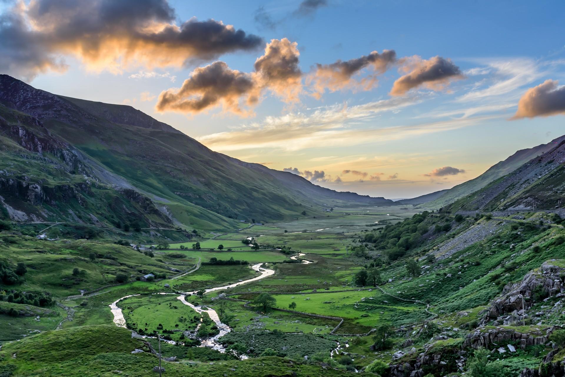 Aerial view of mountain range in Snowdonia at sunset time