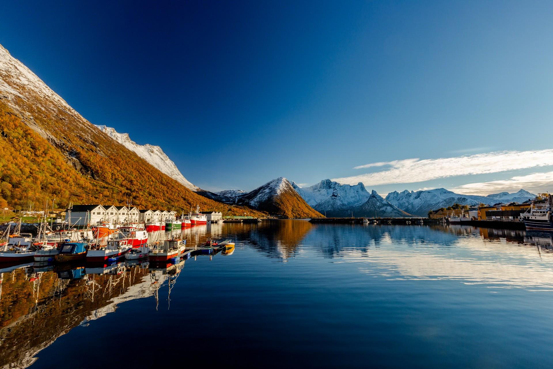 Mountain range in Senja on a sunny day with some clouds