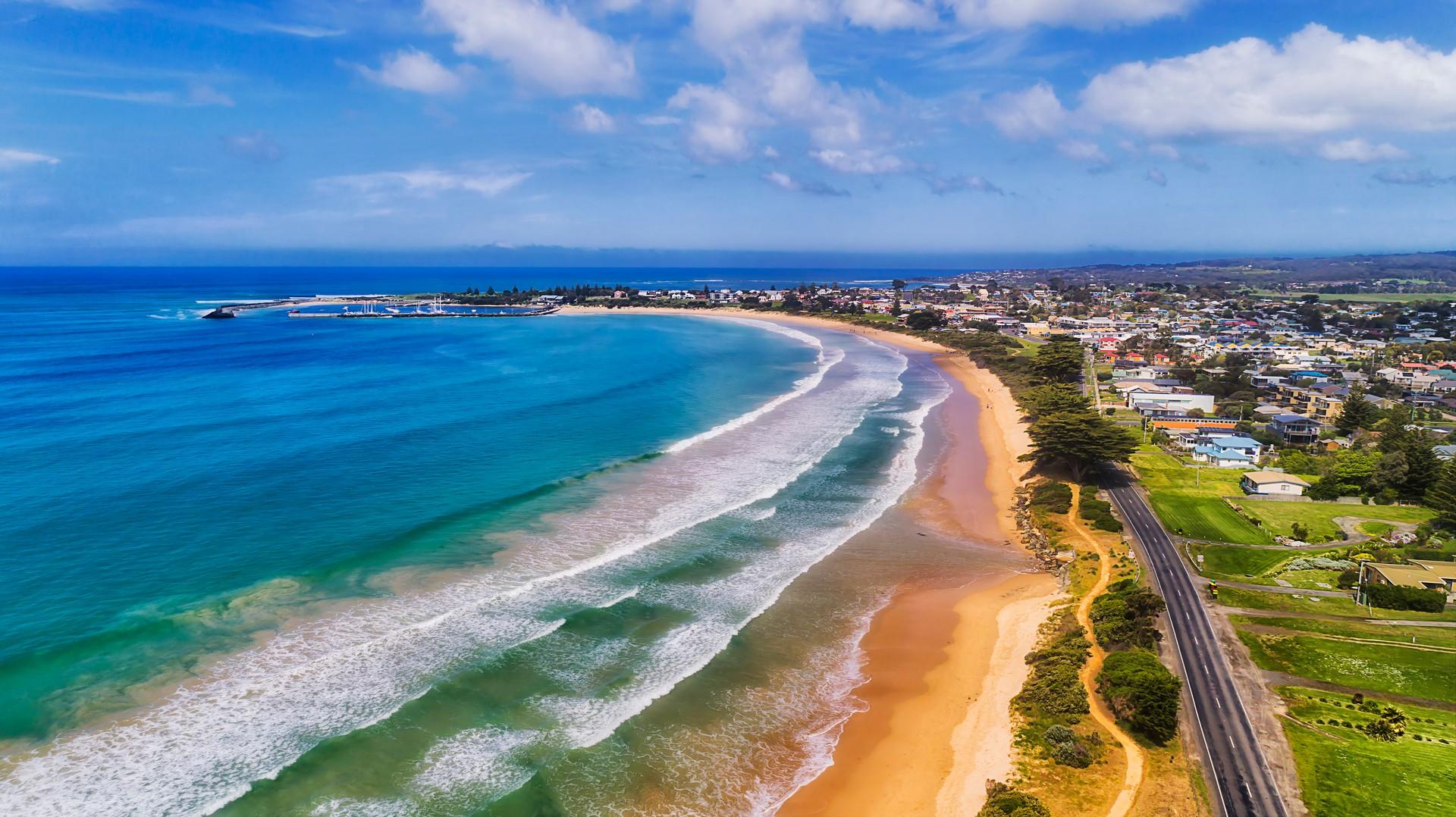 Aerial view of beach in Apollo Bay in sunny weather with few clouds