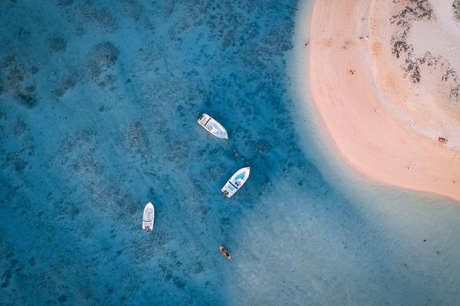 The view of a blue lagoon and a beach