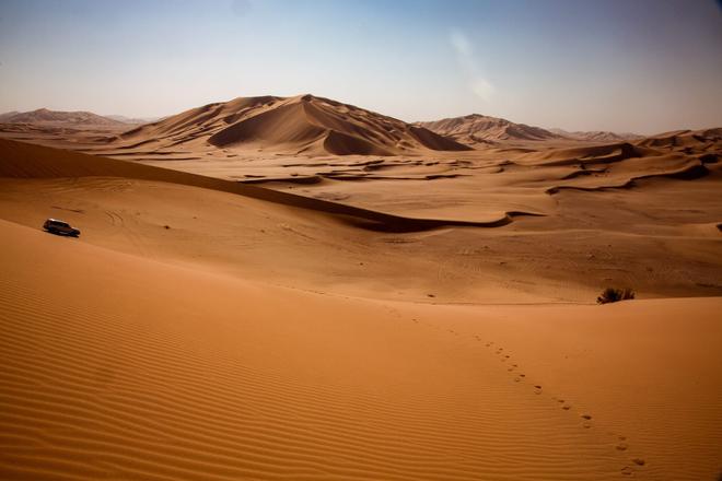 A car passing through desert in Oman