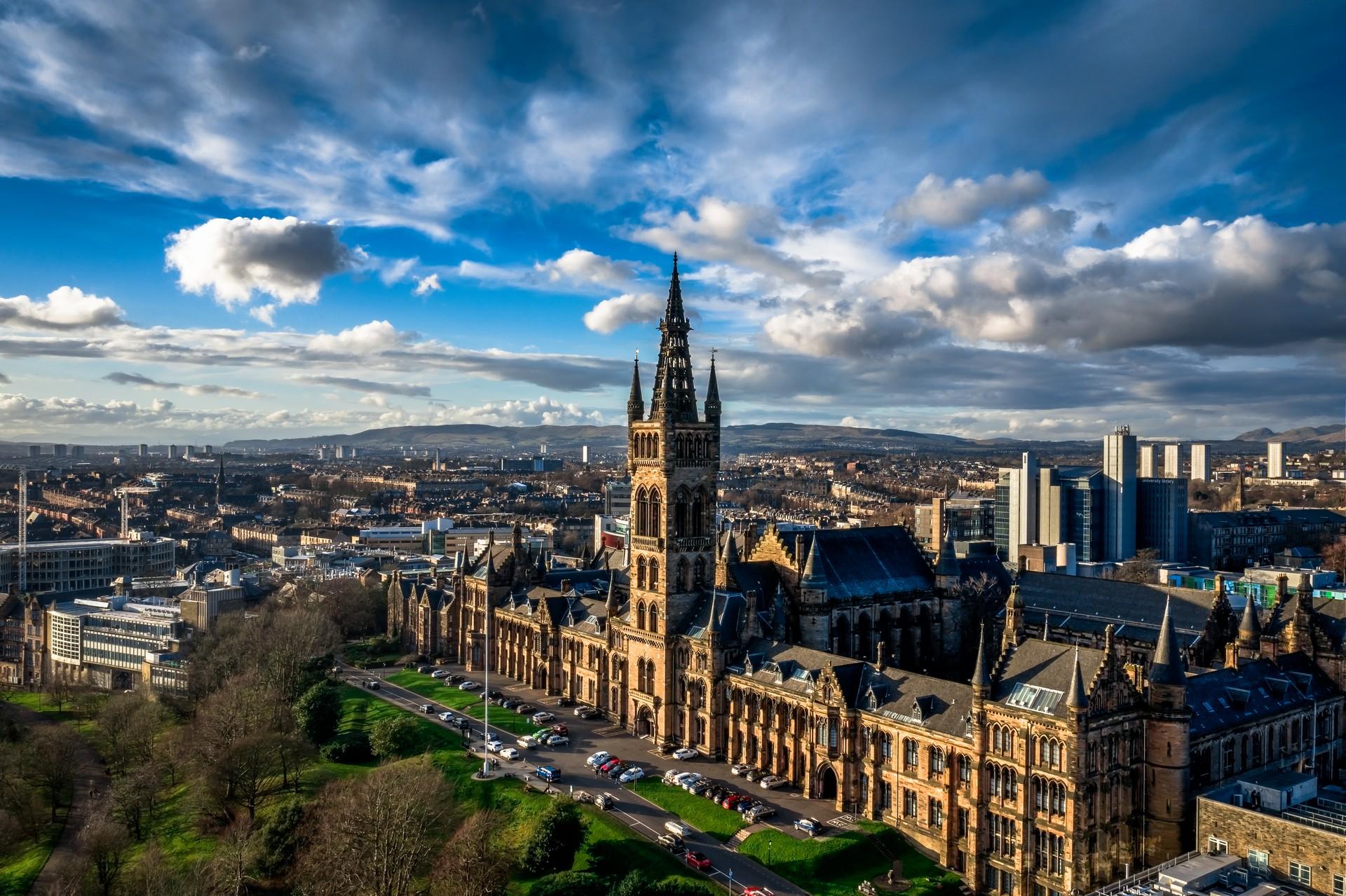 Aerial view of architecture in Glasgow on a sunny day with some clouds